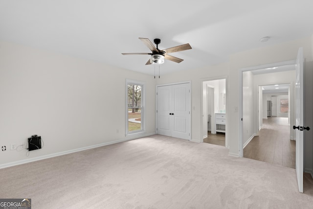 9 Wimbledon Ct, Statesboro, GA 30458 - unfurnished bedroom featuring carpet flooring, baseboards, a closet, and ceiling fan