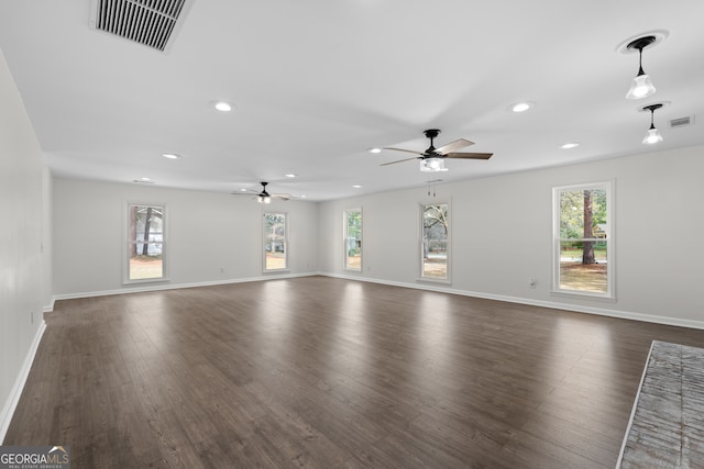 9 Wimbledon Ct, Statesboro, GA 30458 - unfurnished living room with healthy amount of natural light, ceiling fan, dark wood-style floors, recessed lighting, and baseboards