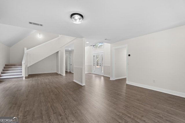 9 Wimbledon Ct, Statesboro, GA 30458 - unfurnished living room featuring dark wood-style floors, stairway, baseboards, and lofted ceiling
