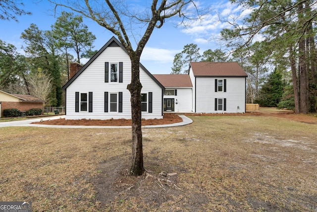 9 Wimbledon Ct, Statesboro, GA 30458 - view of front of house with a chimney and a front yard