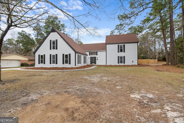 9 Wimbledon Ct, Statesboro, GA 30458 - view of front of house featuring a detached garage, an outbuilding, and a shingled roof