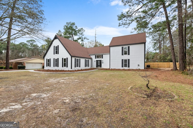 9 Wimbledon Ct, Statesboro, GA 30458 - back of house with a detached garage, an outdoor structure, and roof with shingles