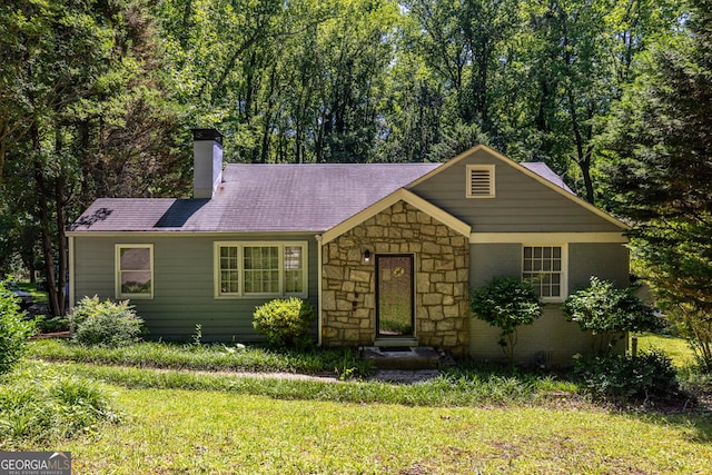 1268 Thomas Rd, Decatur, GA 30030 - ranch-style home with a chimney, a front yard, stone siding, and roof with shingles
