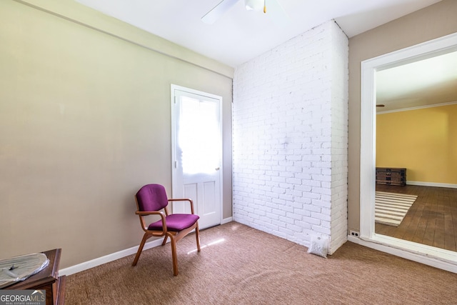 1268 Thomas Rd, Decatur, GA 30030 - unfurnished room featuring brick wall, a ceiling fan, baseboards, and carpet floors