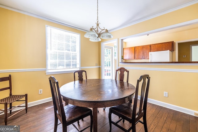 1268 Thomas Rd, Decatur, GA 30030 - dining space featuring a chandelier, ornamental molding, dark wood finished floors, and baseboards