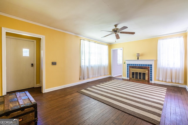 1268 Thomas Rd, Decatur, GA 30030 - unfurnished living room featuring hardwood / wood-style flooring, ornamental molding, baseboards, a fireplace, and a ceiling fan
