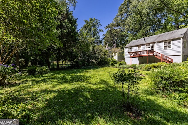 1268 Thomas Rd, Decatur, GA 30030 - view of grassy yard featuring a deck and stairs