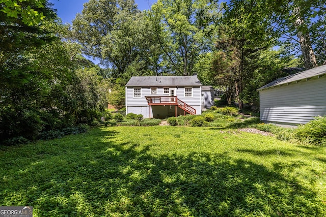 1268 Thomas Rd, Decatur, GA 30030 - rear view of house with stairs, a wooden deck, and a yard