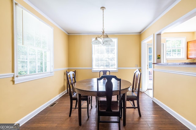 1268 Thomas Rd, Decatur, GA 30030 - dining room featuring dark wood-style flooring, a chandelier, ornamental molding, and baseboards