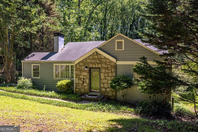 1268 Thomas Rd, Decatur, GA 30030 - ranch-style house with a front lawn, a chimney, stone siding, and roof with shingles