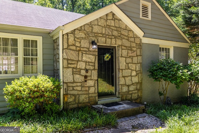 1268 Thomas Rd, Decatur, GA 30030 - view of exterior entry with stone siding and roof with shingles