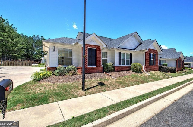 150 Old Mill Rd Unit 331, Cartersville, GA 30120 - view of front of property featuring brick siding, a front lawn, and roof with shingles