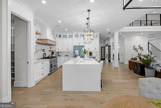 2631 Sardis Way, Buford, GA 30519 - kitchen with range with two ovens, premium range hood, light countertops, recessed lighting, and tasteful backsplash