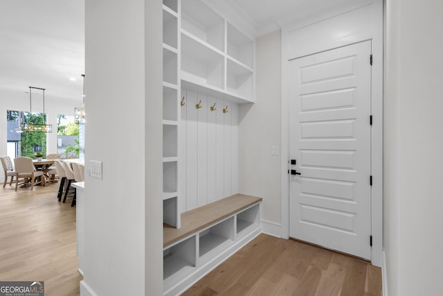 2631 Sardis Way, Buford, GA 30519 - mudroom featuring wood finished floors and crown molding
