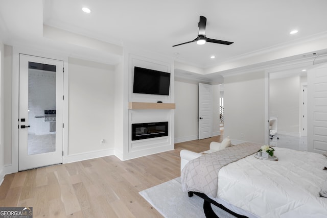 2631 Sardis Way, Buford, GA 30519 - bedroom with wood finished floors, recessed lighting, a glass covered fireplace, crown molding, and baseboards