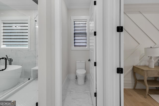 2631 Sardis Way, Buford, GA 30519 - bathroom with a soaking tub, toilet, marble look tiles, and plenty of natural light