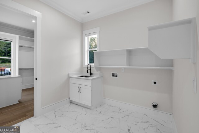 2631 Sardis Way, Buford, GA 30519 - laundry area with hookup for an electric dryer, cabinet space, washer hookup, baseboards, and plenty of natural light