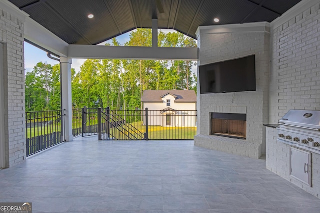 2631 Sardis Way, Buford, GA 30519 - view of patio / terrace with an outdoor brick fireplace and view of wooded area