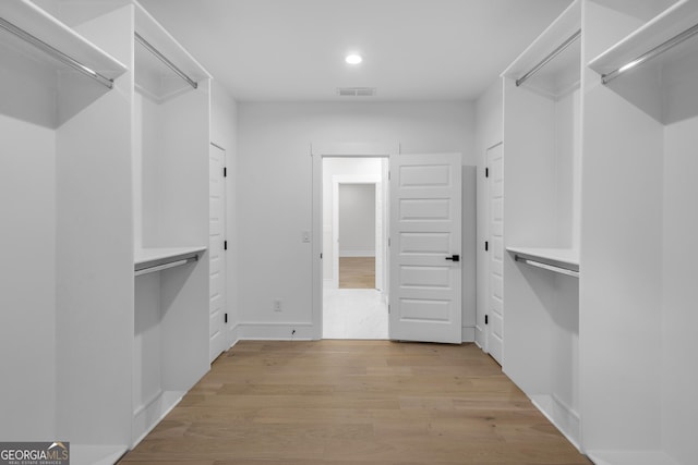 2631 Sardis Way, Buford, GA 30519 - spacious closet featuring light wood-style flooring