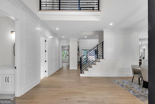 2631 Sardis Way, Buford, GA 30519 - entryway featuring a decorative wall, stairs, ornamental molding, light wood-style floors, and recessed lighting