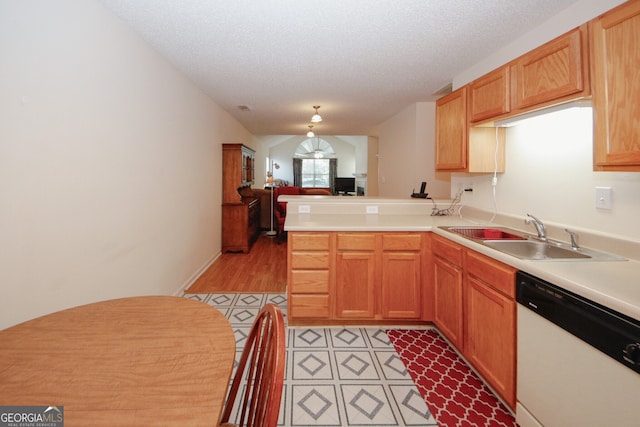2191 Rockbridge Rd Unit 103, Stone Mountain, GA 30087 - kitchen featuring white dishwasher, a sink, a peninsula, light countertops, and open floor plan