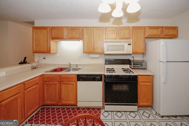 2191 Rockbridge Rd Unit 103, Stone Mountain, GA 30087 - kitchen featuring white appliances, a sink, light countertops, a chandelier, and a textured ceiling