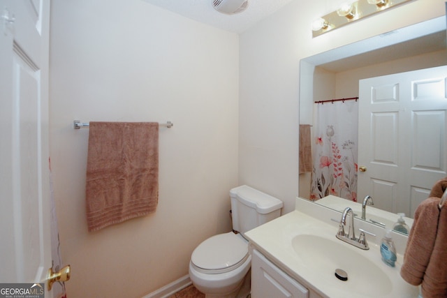 2191 Rockbridge Rd Unit 103, Stone Mountain, GA 30087 - full bathroom with vanity, toilet, and baseboards