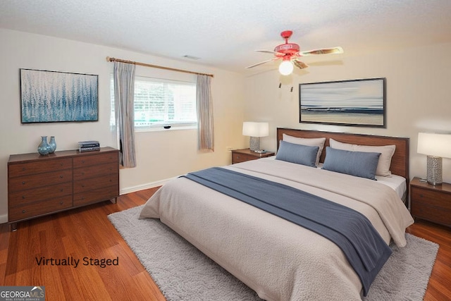 2191 Rockbridge Rd Unit 103, Stone Mountain, GA 30087 - bedroom with wood finished floors, ceiling fan, and baseboards