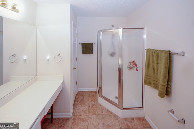2191 Rockbridge Rd Unit 103, Stone Mountain, GA 30087 - bathroom with vanity, a stall shower, and tile patterned floors