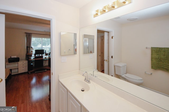 2191 Rockbridge Rd Unit 103, Stone Mountain, GA 30087 - bathroom featuring wood finished floors, vanity, and toilet