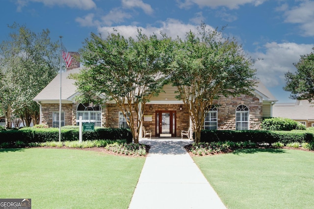 2191 Rockbridge Rd Unit 103, Stone Mountain, GA 30087 - view of front of property with stone siding and a front yard