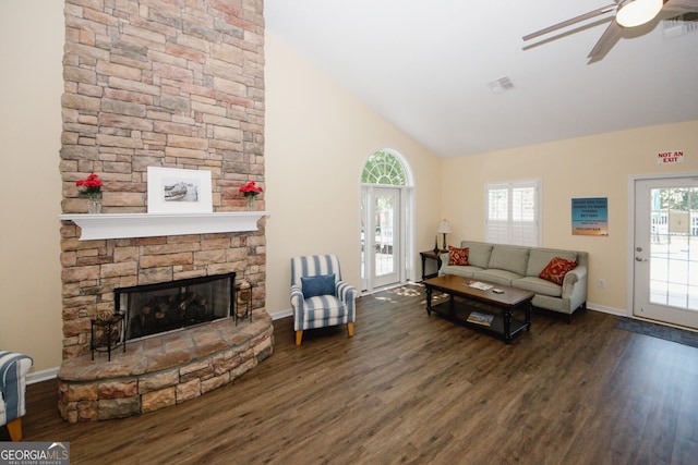 2191 Rockbridge Rd Unit 103, Stone Mountain, GA 30087 - living room with wood finished floors, high vaulted ceiling, ceiling fan, a stone fireplace, and baseboards