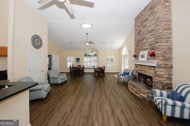 2191 Rockbridge Rd Unit 103, Stone Mountain, GA 30087 - living room featuring a ceiling fan, dark wood-style floors, high vaulted ceiling, and a fireplace