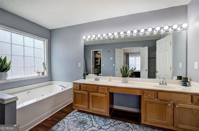 2908 Cottesford Way, Smyrna, GA 30080 - full bath with double vanity, wood finished floors, and a tub with jets
