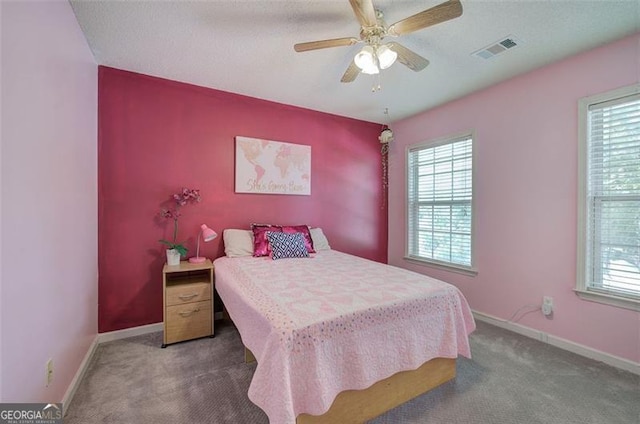 2908 Cottesford Way, Smyrna, GA 30080 - carpeted bedroom featuring multiple windows, baseboards, and a ceiling fan