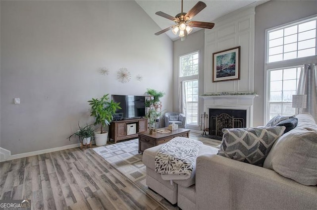 2908 Cottesford Way, Smyrna, GA 30080 - living area featuring high vaulted ceiling, a ceiling fan, light wood-style flooring, a fireplace, and baseboards