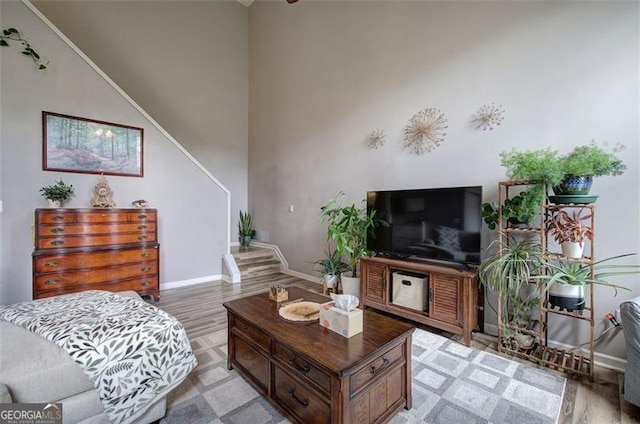 2908 Cottesford Way, Smyrna, GA 30080 - living room featuring baseboards, light wood finished floors, and a high ceiling