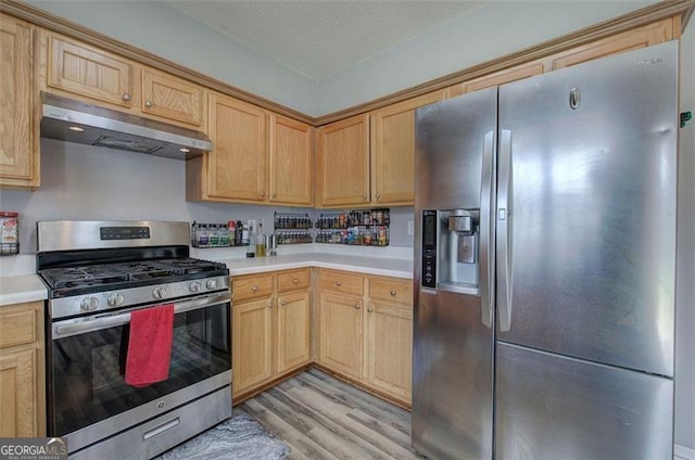 2908 Cottesford Way, Smyrna, GA 30080 - kitchen featuring stainless steel appliances, under cabinet range hood, light countertops, light wood finished floors, and light brown cabinetry