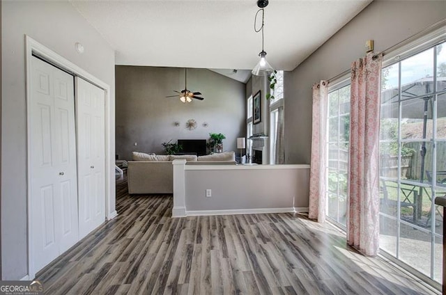 2908 Cottesford Way, Smyrna, GA 30080 - unfurnished dining area with a ceiling fan, wood finished floors, vaulted ceiling, and baseboards