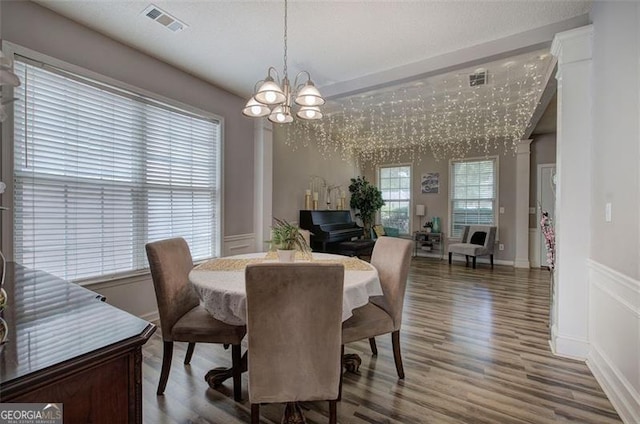 2908 Cottesford Way, Smyrna, GA 30080 - dining area featuring a chandelier, wood finished floors, wainscoting, and a decorative wall