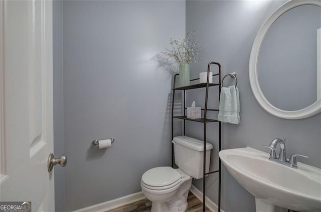 2908 Cottesford Way, Smyrna, GA 30080 - bathroom featuring toilet, a sink, wood finished floors, and baseboards