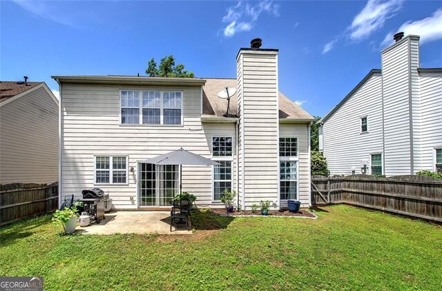 2908 Cottesford Way, Smyrna, GA 30080 - rear view of house with a patio and a chimney