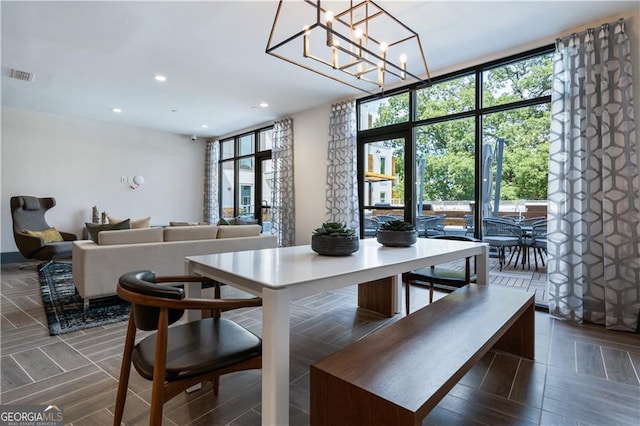 775 Juniper St NE Unit 405, Atlanta, GA 30308 - dining area with recessed lighting, a chandelier, and wood finished floors