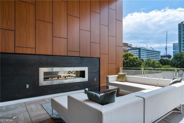 775 Juniper St NE Unit 405, Atlanta, GA 30308 - living room featuring a view of city and a glass covered fireplace
