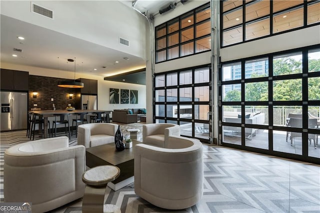 775 Juniper St NE Unit 405, Atlanta, GA 30308 - community lobby featuring a towering ceiling and recessed lighting