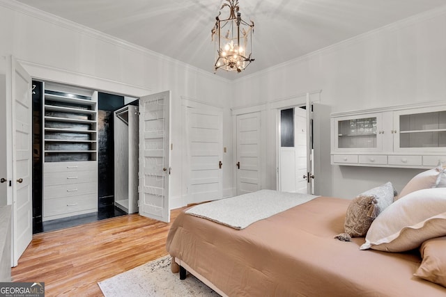 1157 Alta Ave NE, Atlanta, GA 30307 - bedroom with a chandelier, ornamental molding, and wood finished floors