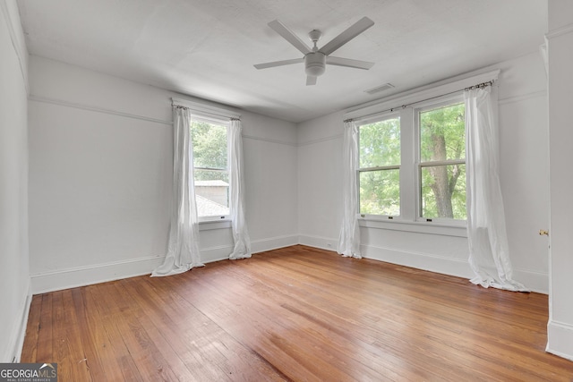 1157 Alta Ave NE, Atlanta, GA 30307 - spare room featuring light wood finished floors, ceiling fan, and baseboards