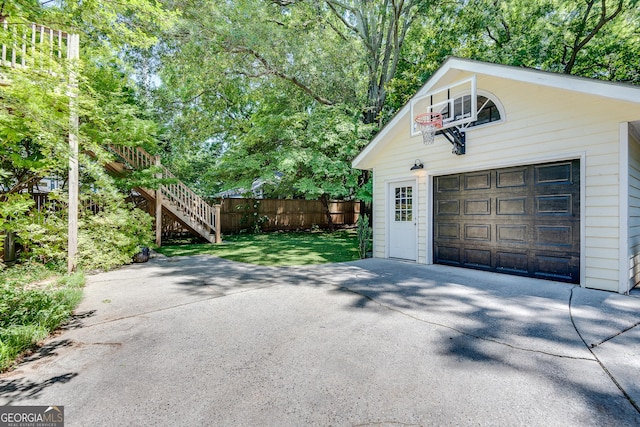 1157 Alta Ave NE, Atlanta, GA 30307 - detached garage featuring concrete driveway and view of scattered trees