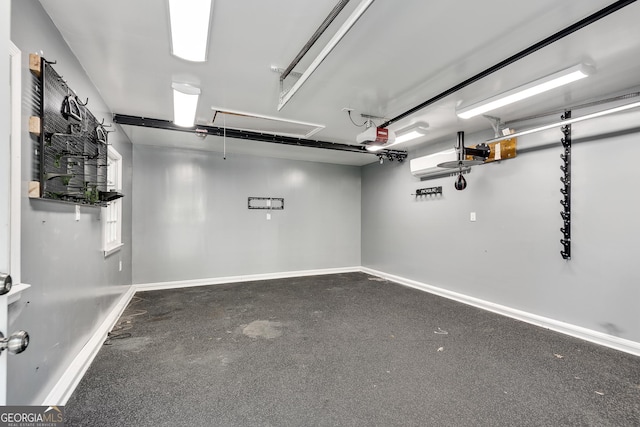 1157 Alta Ave NE, Atlanta, GA 30307 - garage with a garage door opener and baseboards
