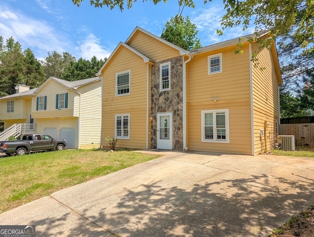 2918 Pavia Cir, Austell, GA 30106 - view of front of home with cooling unit, stone siding, and driveway